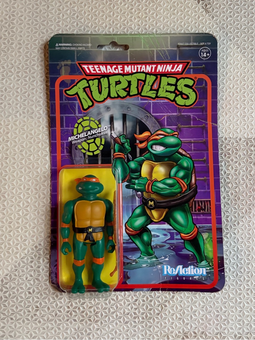 Super7 Teenage Mutant Ninja Turtles Michelangelo 3.75 in Reaction Figure